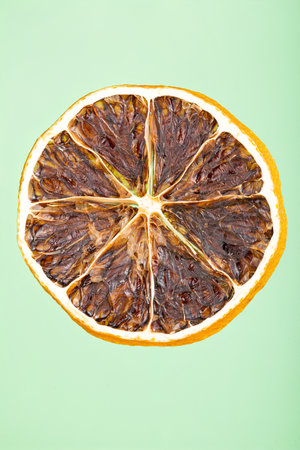 Dried lemon slice isolated on blue background.の写真素材
