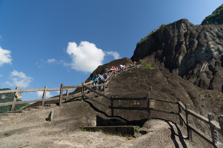 Tourists hiking up along the path of the hillsのeditorial素材