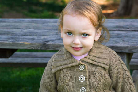 Closeup portrait of cute little girl outdoors