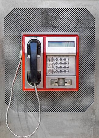 Public telephone with metal keypad dialの写真素材