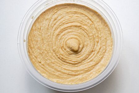 Hummus spread dip in jar middle east cuisineの写真素材
