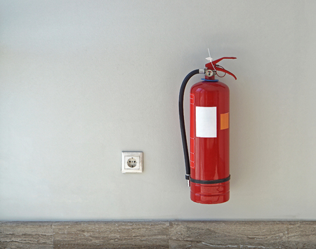 Fire extinguisher protectuion device at wallの写真素材