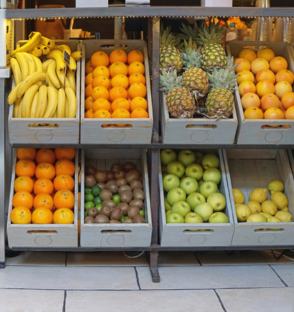 Crates with fresh fruits in juice barの写真素材