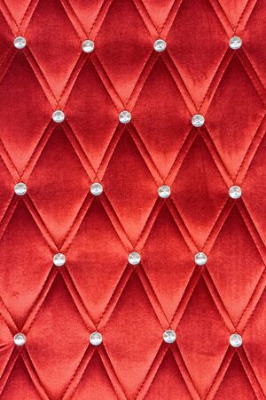 Red upholstery pattern with zircons decoration