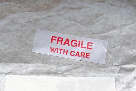 Fragile with care sticker at mail postの写真素材