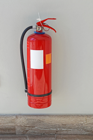 Fire extinguisher protection device at wallの写真素材