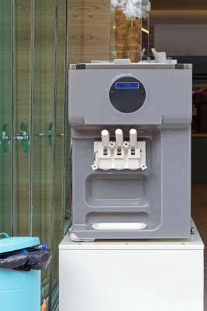 Soft ice cream machine with three flavorの写真素材