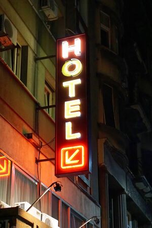 Hotel neon sign at nightの写真素材