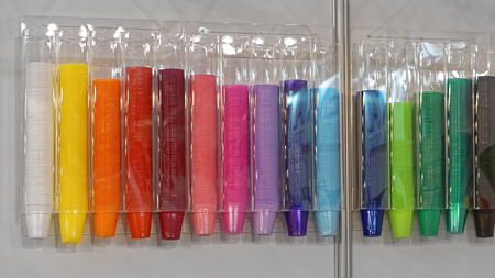 Plastic cups color in wall dispenser