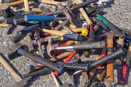 Big bunch of various shape and sizes of used hammers toolsの写真素材