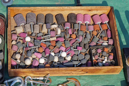 Grind stone bits tools in wooden box