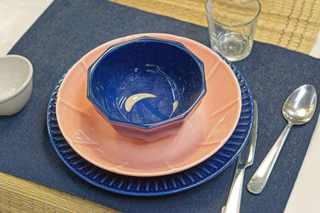 Modern bowl and plates dining table for oneの写真素材
