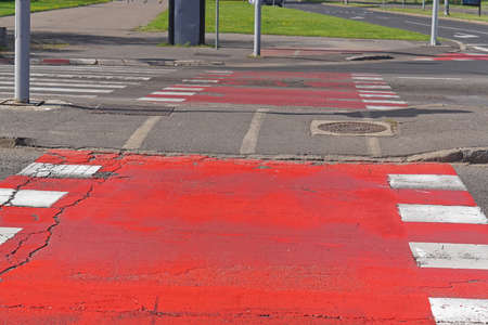 Red paint street crossing for bicyclesの写真素材