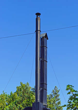 Two black metal chimney pipes at grillの写真素材