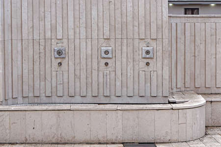 White marble drinking water fountain in city parkの写真素材