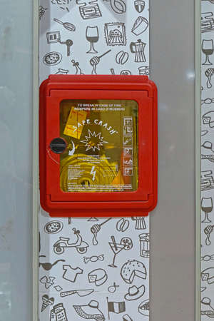 Rome, Italy - January 28, 2016: Fire hose water hydrant in safety box crash glass at airport in Rome.のeditorial素材