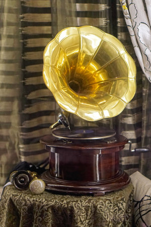 Antique crank turntable with big golden hornの写真素材