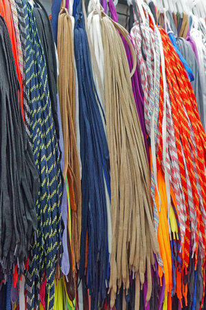 Many new colorful shoe laces hanging