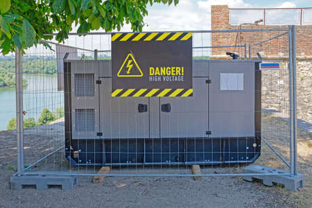 Electric power generator box in protective cage