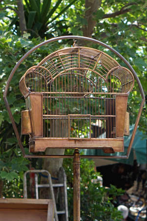 Antique copper metal bird cage with pole standの写真素材