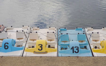 Rental pedal boats parking at calm lake