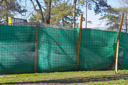 Green fence at construction site in park
