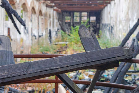 Wooden beam fire damage in long hallの写真素材