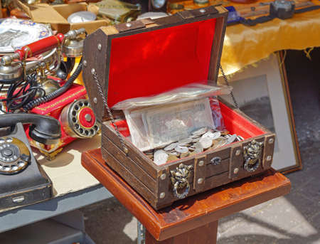 Athens, Greece - May 3, 2015: Treasure chest old money antique shop at flea market in Athens.のeditorial素材