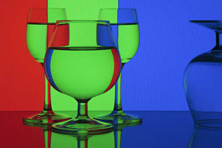 Abstraction - RGB (red, green, blue).Glasses on colorful background.の写真素材