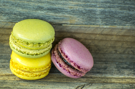 Colorful macaroons. macaroons on wooden table.の写真素材