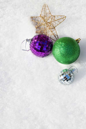 Christmas balls and a star in the snow, top view.Copy and paste.の写真素材