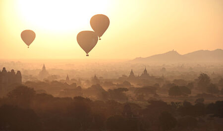 Silhouette of Hot Air Balloons over the temples of Bagan in misty morning, Myanmarの写真素材