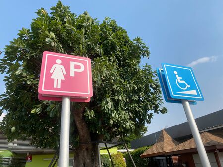 ladies parking sign for toilet on road.