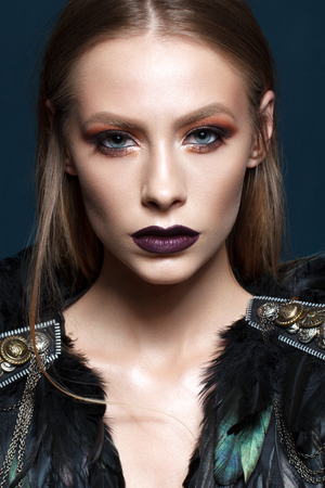 Beautiful young model with fashion make up, perfect skin, stylish look. Trendy lip colorの写真素材