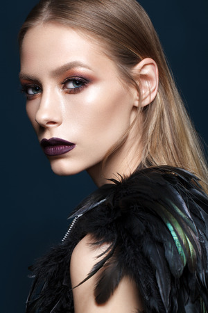 Beautiful young model with fashion make up, perfect skin, stylish look. Trendy lip colorの写真素材
