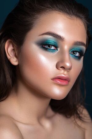 Portrait of a beautiful young model with bright blue trendy smoky eyes, blue eyes, perfect skin and natural lips.の写真素材