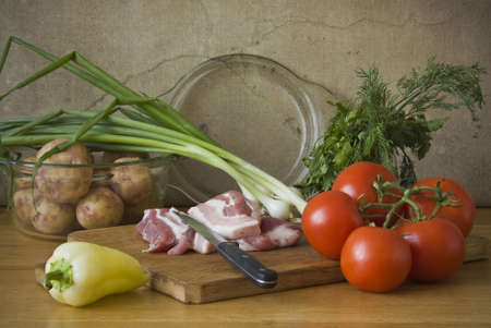 A still life picture showing preparation for cooking roast meat with potatoの写真素材