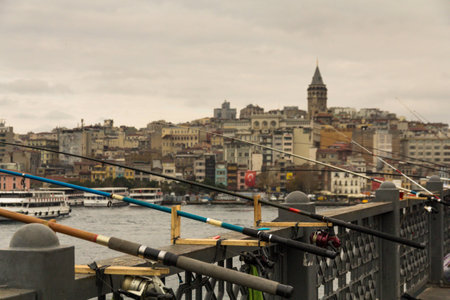 Many fishing rods are fixed on the Galata bridge of the Turkish city of Istanbul, there are no fishermen nearbyの写真素材
