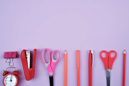 school supplies on a purple background. High quality photo