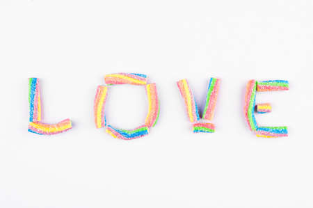 Word "Love" made of multicolored jelly candies.の写真素材
