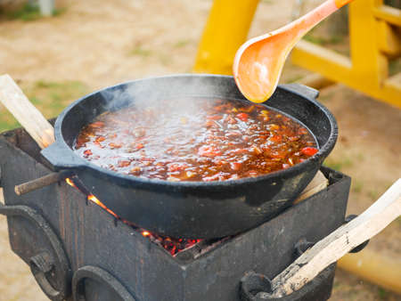Close-up of hurpa soup in a large cast-iron cauldron outdoor.の写真素材