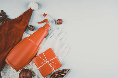 Winter holidays during coronavirus COVID-19 pandemic. Christmas and New Year decoration, protective medical gloves.の写真素材