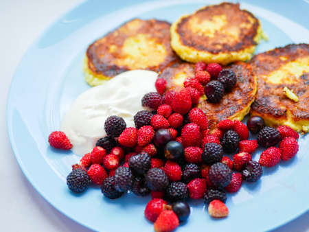 Cottage cheese pancakes with berries.の写真素材