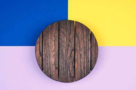 Top view of wooden stand on multi-colored background.の写真素材