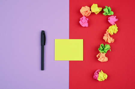 Colorful layout with pen, sticker and question mark.