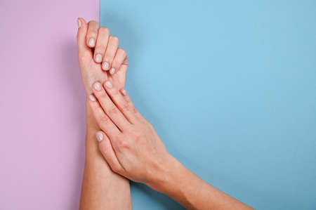 Nails care and beauty theme. Blue and violet pastel backround with copy space.の写真素材