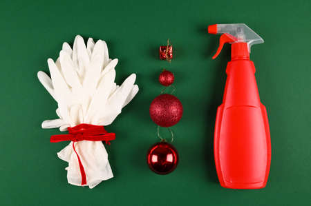 Top view of medical gloves, red christmas balls and bottle of disinfectant. Medicine festive concept banner during coronavirus covid-19 time.の写真素材