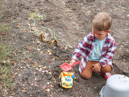 Little caucasian baby boy playing on the ground.の写真素材