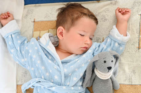 Itâs bedtime for baby and rabbit.の写真素材