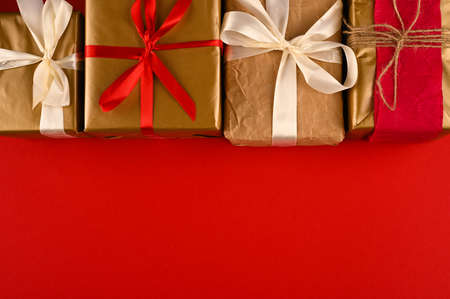 Arranged christmas gift boxes on red surface.の写真素材